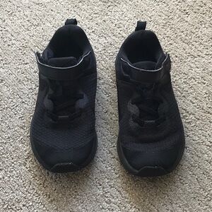 All black Nike running sneakers